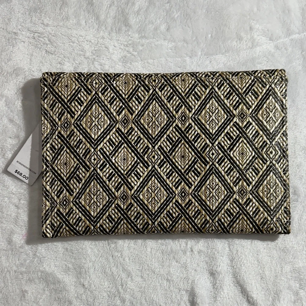 NWT BCBG cream,tan and black woven envelope clutch